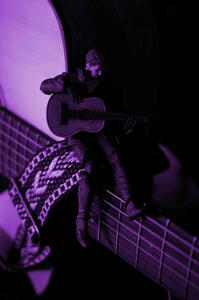 Cid from final fantasy 16, playing a guitar while sitting on a real life guitar. in purple