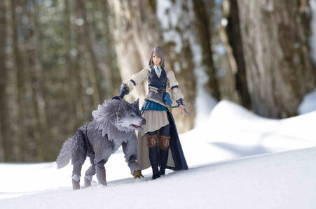 Jill and Torgal from the video game Final Fantasy 16, walking through the woods in the winter